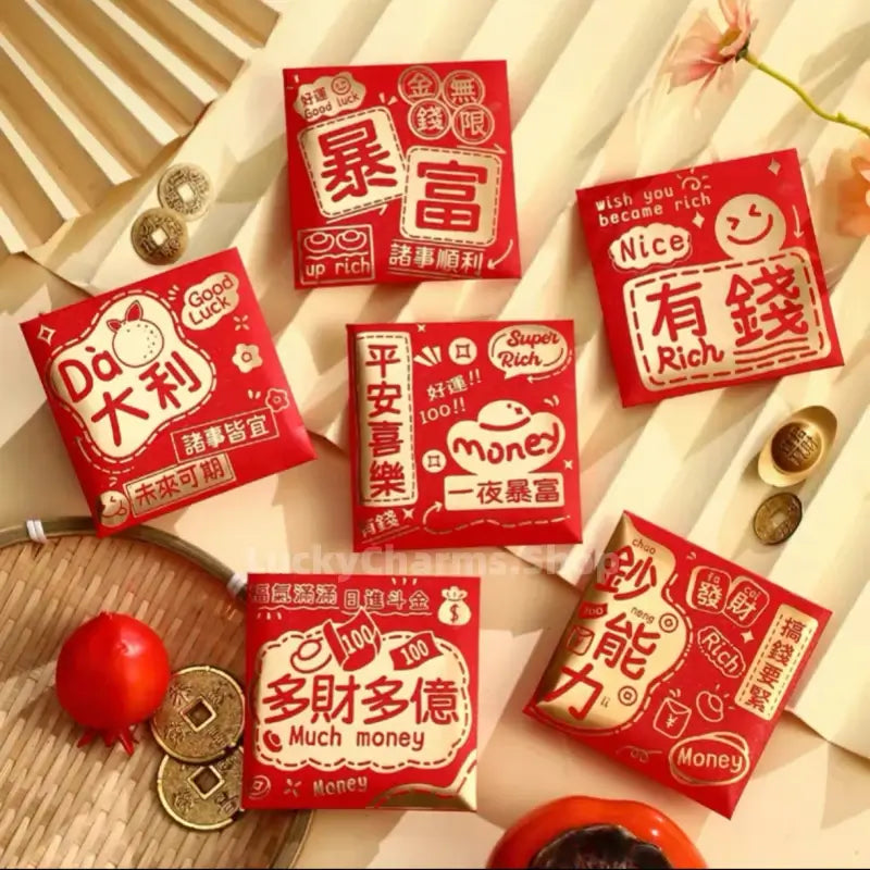 6 square Chinese red envelopes featuring festive golden characters and playful doodles on a white paper fan backdrop.