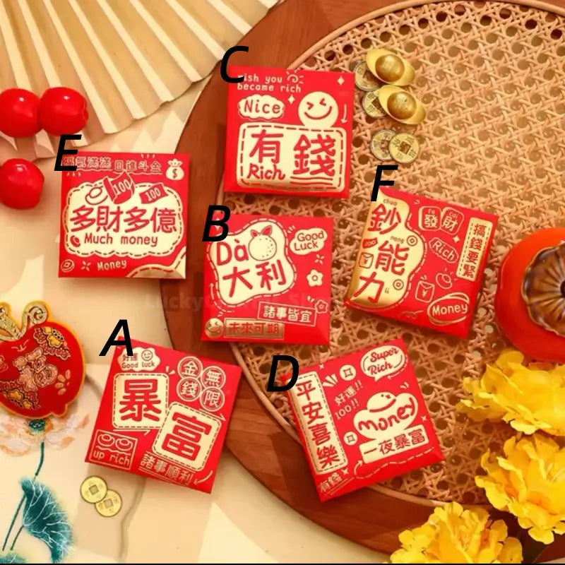 6 square Chinese red envelopes labeled A to F on a woven tray surrounded by gold ingots and yellow flowers.