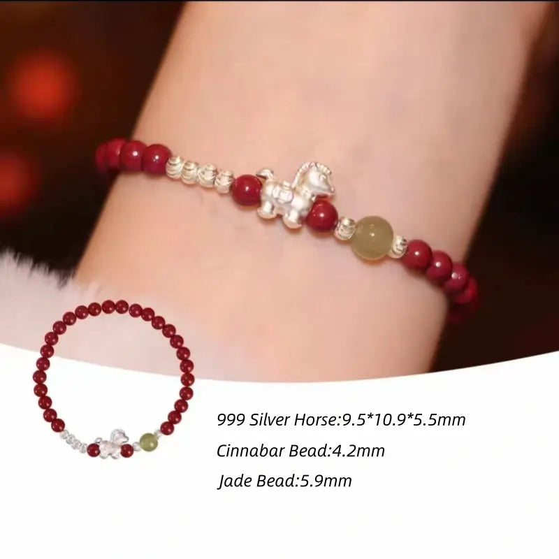 999 silver Horse charm red string bracelet with natural cinnabar, jade bead, and size details on wrist.
