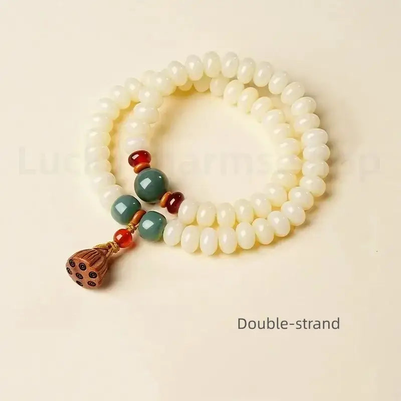 A double-strand white jade bodhi seed mala bracelet with a 14mm wooden lotus seedpod pendant, labeled as double-strand.