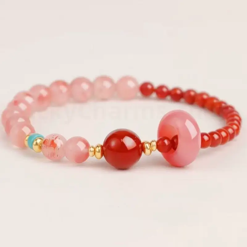 A single-strand natural Southern Red Agate bead bracelet featuring a turquoise charm for mindfulness.