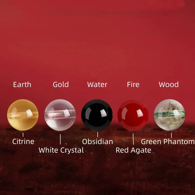 Five Elements energy gemstones including Citrine, White Crystal, Obsidian, Red Agate, and Green Phantom.
