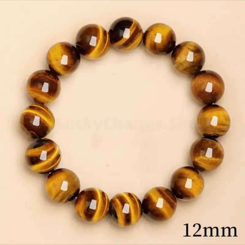 Large 12mm natural yellow tiger's eye healing bracelet featuring polished round protection crystal beads.