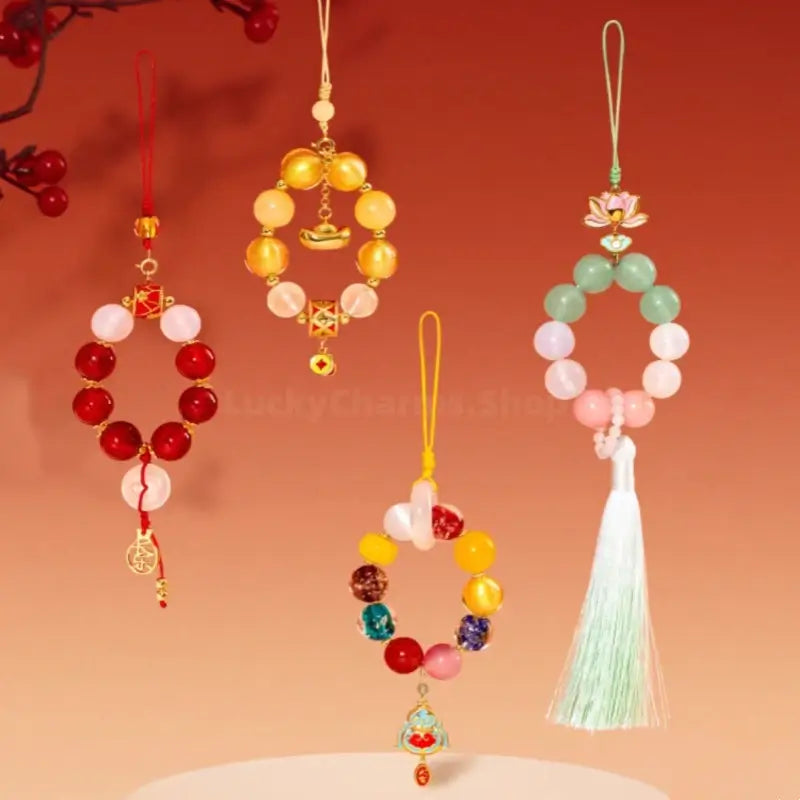 Four Palace Museum beaded phone charms in yellow, multicolor, pastel green, and red styles.