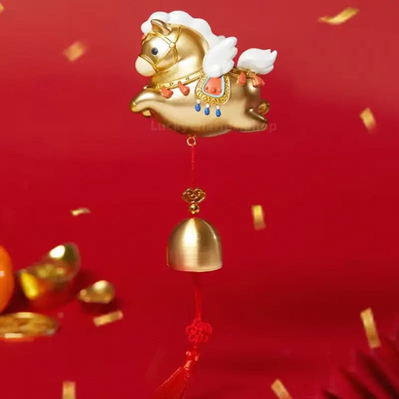 Golden Palace Museum winged horse fridge magnet with hanging brass blessing bell and red tassel.
