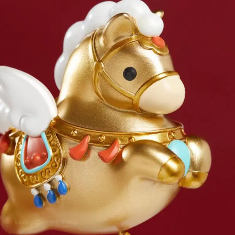 Close-up of golden Palace Museum winged horse magnet showing intricate saddle and mane details.