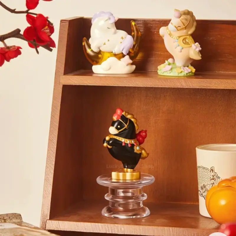 Palace Museum Little Fortune Horse collectible figurines showcased on wooden display shelves with plum blossoms.