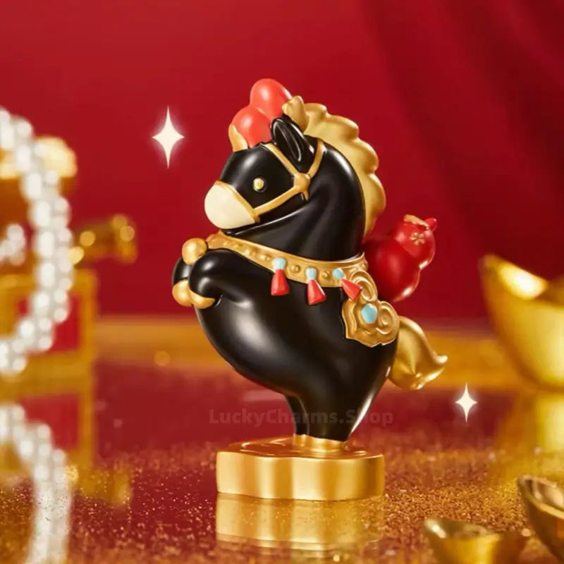 Black Palace Museum fortune horse figurine with red gourd and gold accents on sparkling surface.