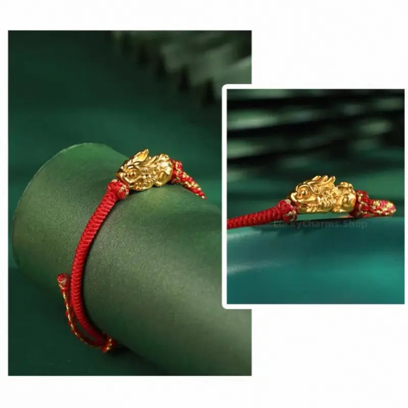 Close-up of red hand-woven lucky bracelet with a Palace Museum gold-plated Pixiu charm.