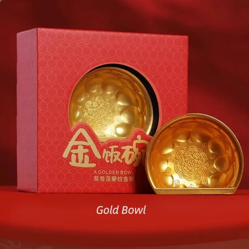 Tang Dynasty style gold bowl fridge magnet with lotus engravings alongside red display box.