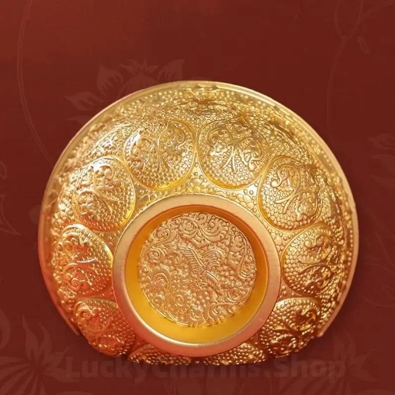 Top-down view of intricate floral and bird Relief carvings on gold bowl fridge magnet back.
