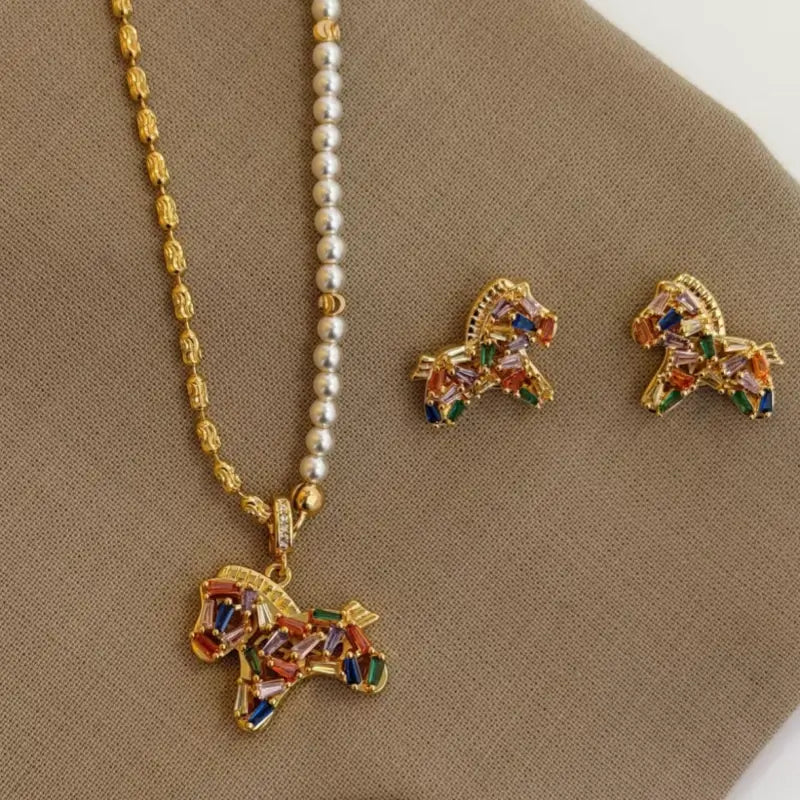 Colorful zircon pony pendant pearl necklace and matching stud earrings jewelry set display.