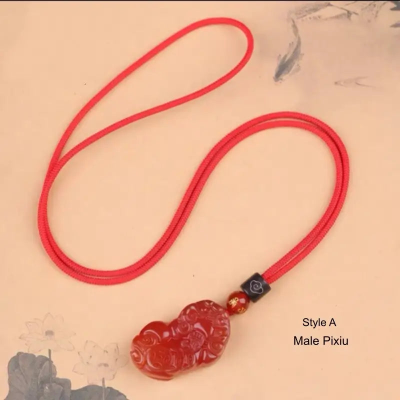 Style A Male Pixiu pendant necklace made of natural red agate with red rope chain.