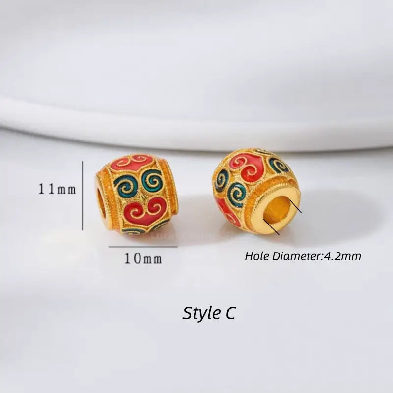 Style C red and blue enamel cloud pattern gold-plated barrel bead. 11x10mm with 4.2mm hole.