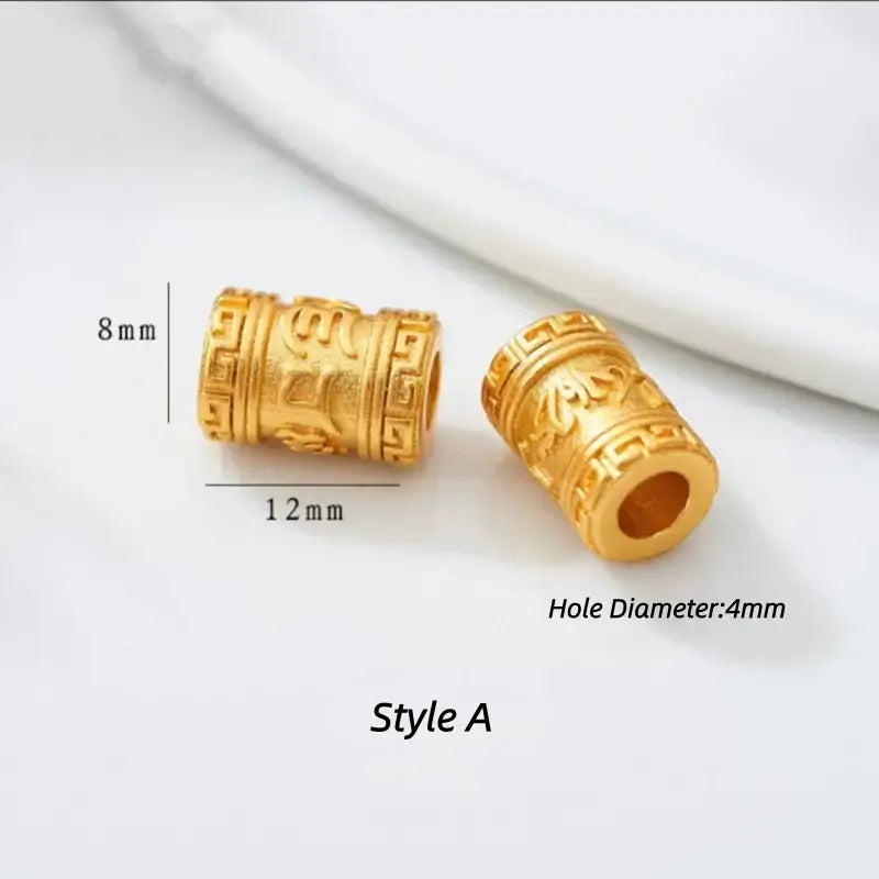 Style A gold-plated cylindrical bead with engraved Six-Word Mantra. 12x8mm, 4mm hole.