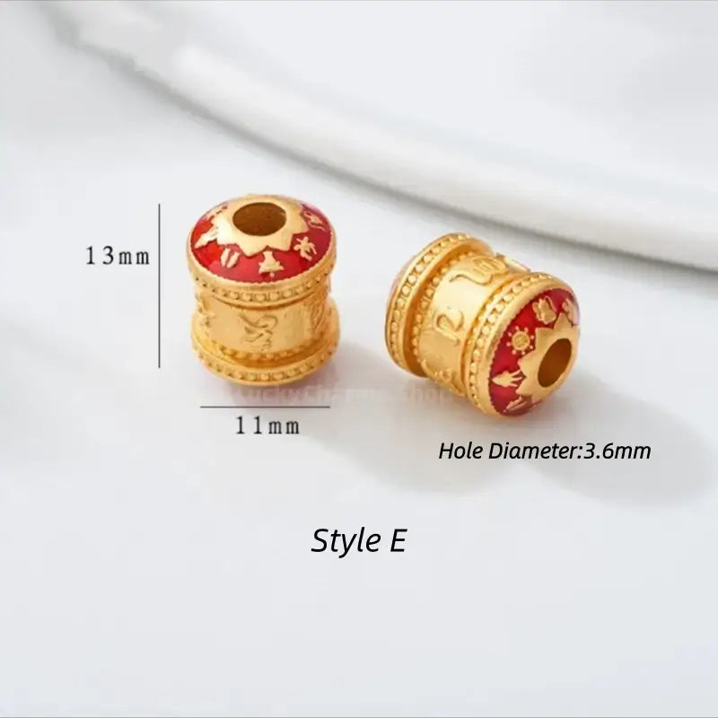 Style E gold-plated prayer wheel barrel bead with red enamel coating. 13x11mm, 3.6mm hole.