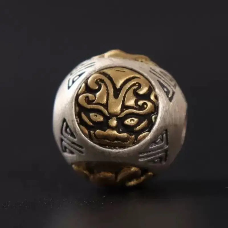 Detail view of White Tiger mythic beast inlay on a vintage 925 silver spacer bead.