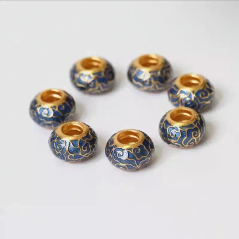 Circle arrangement of 925 sterling silver gold-plated blue enamel cloud pattern large hole beads.