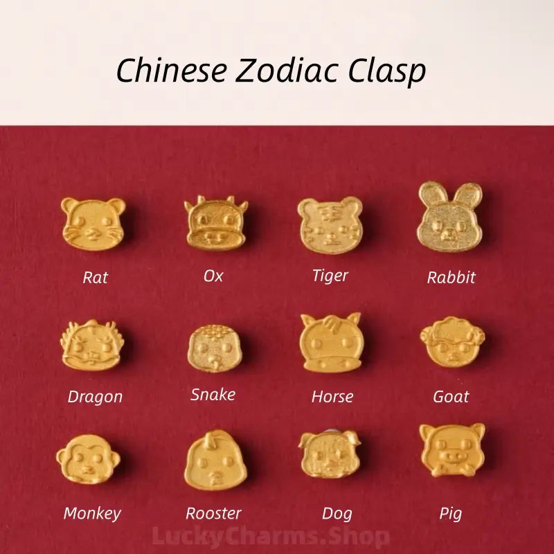 Display of 12 gold Chinese zodiac animal clasps including Rat, Ox, Tiger, Dragon, Snake, Horse, Goat, Monkey, and Pig.
