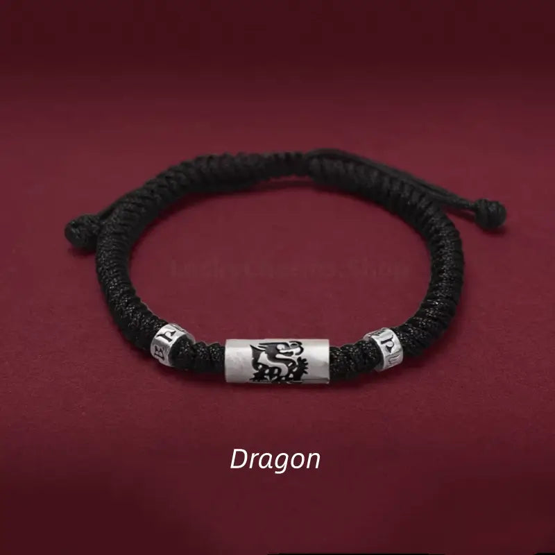 Chinese zodiac Dragon men's black braided bracelet with a 925 sterling silver LuLuTong mantra tube bead.