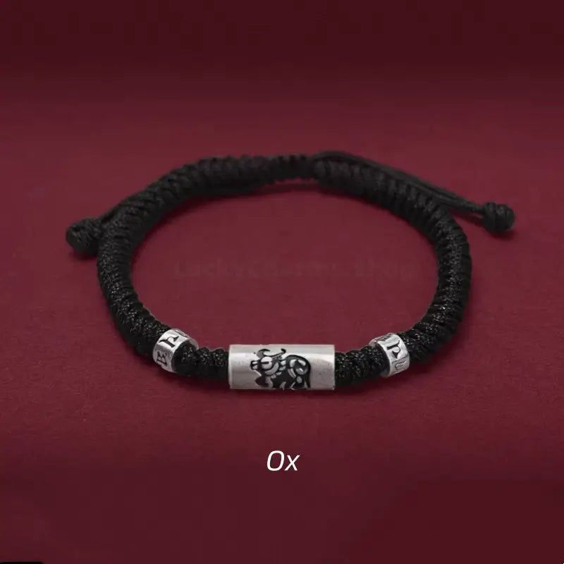 Chinese zodiac Ox men's black braided rope bracelet featuring a 925 sterling silver LuLuTong mantra bead.