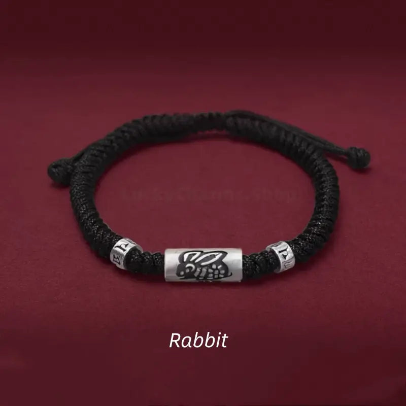 Chinese zodiac Rabbit men's black braided bracelet featuring a 925 sterling silver LuLuTong mantra bead.