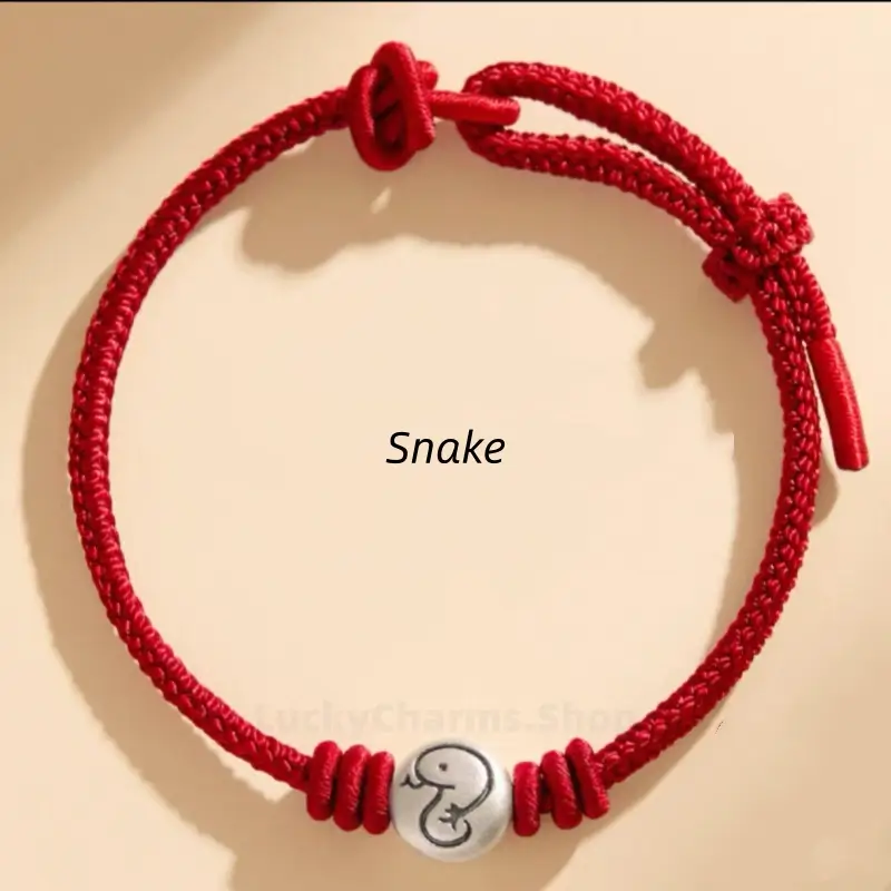Chinese zodiac Snake braided red rope bracelet featuring a 999 fine silver engraved animal charm bead.