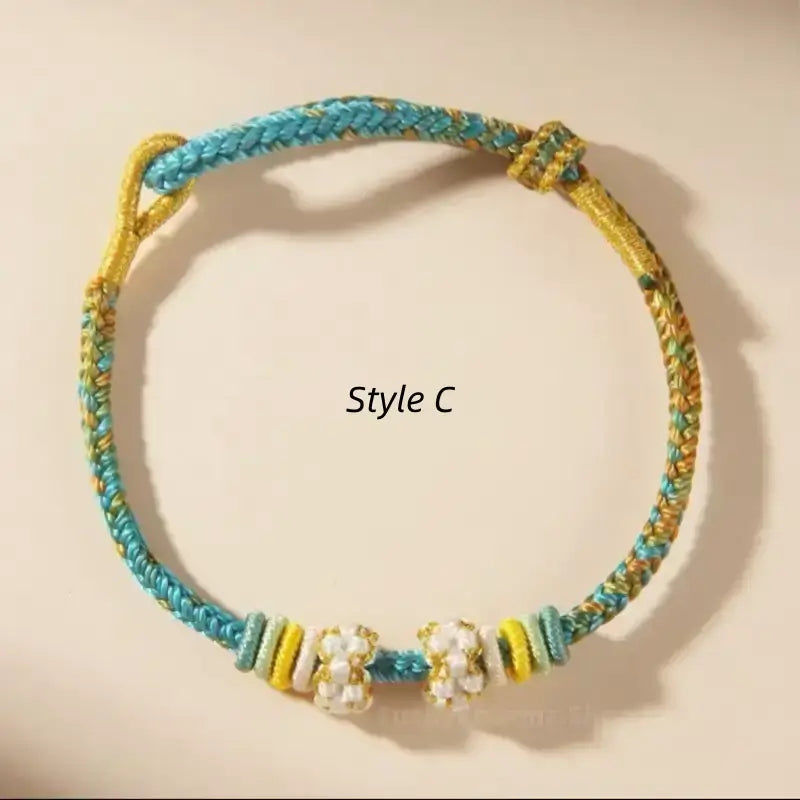 Style C teal and gold gradient braided hand rope bracelet with decorative peach blossom knots.