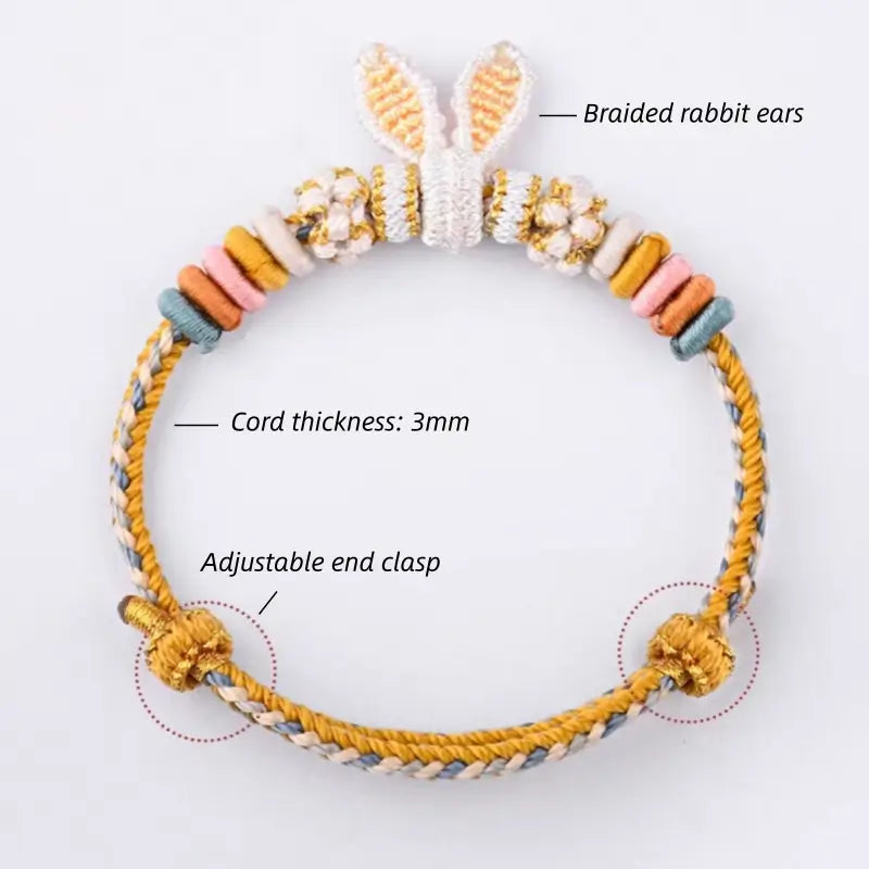 Product diagram showing 3mm braided cord and adjustable end clasp on yellow rabbit ear bracelet.