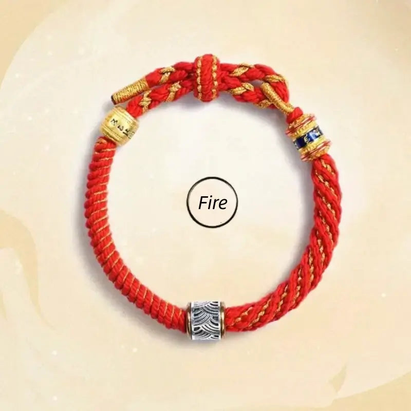 Fire style red handwoven Five Elements guardian bracelet with silver wave pattern bead and gold charms.