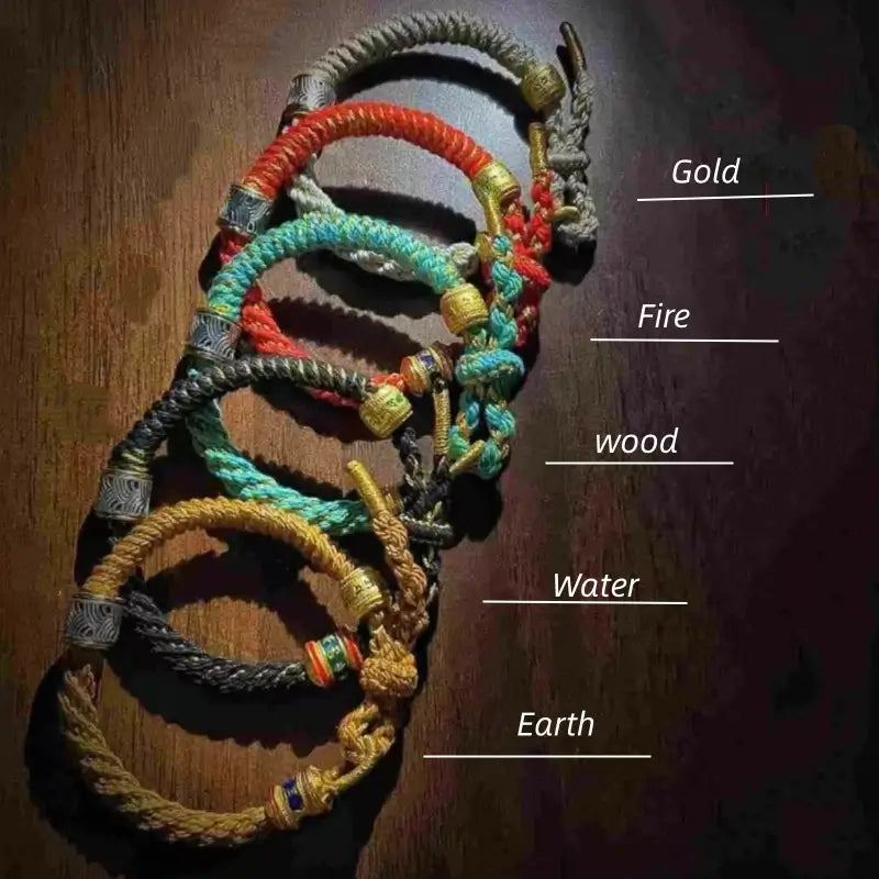 Five Elements braided cord bracelets labeled Gold, Fire, Wood, Water, and Earth with mantra turning beads.