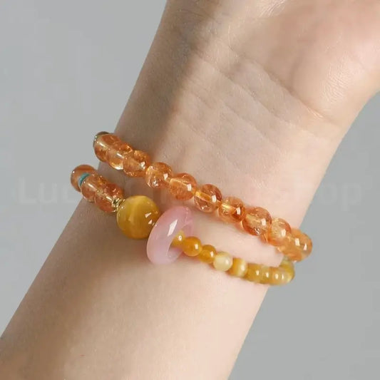 Close-up on-wrist view of the natural faceted citrine gemstone bracelet for wealth and good fortune attraction