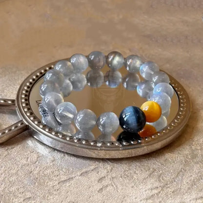 Edelsteinarmband aus mystisch grauem Mondstein und blau-goldenem Tigerauge