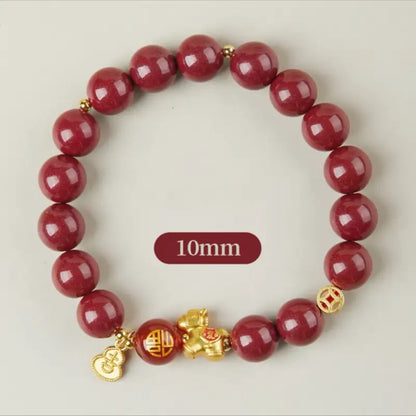 A bold 10mm genuine cinnabar bead bracelet with 925 silver gold-plated prosperity coin and lucky horse pendants.