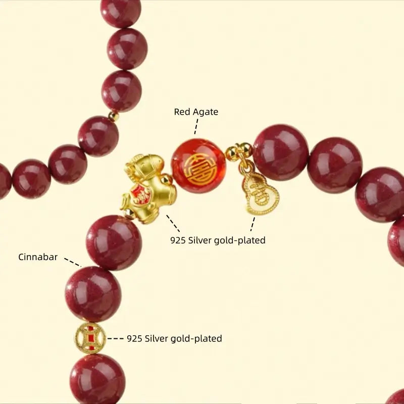 Close-up diagram showing natural cinnabar, red agate bead, and 925 sterling silver gold-plated lucky coin spacer.