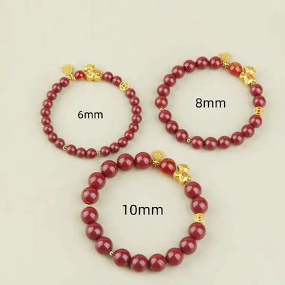 Size comparison of three natural cinnabar bracelets labeled with 6mm, 8mm, and 10mm bead diameters.