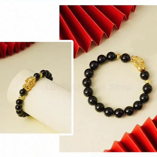A product collage showing a black obsidian wealth bracelet from two angles, displayed alongside decorative red paper fans for a cultural touch.