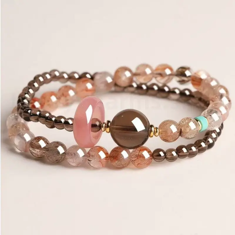 Multi-layer brown smoky quartz gemstone blessing bracelet featuring a smooth pink quartz charm and turquoise bead