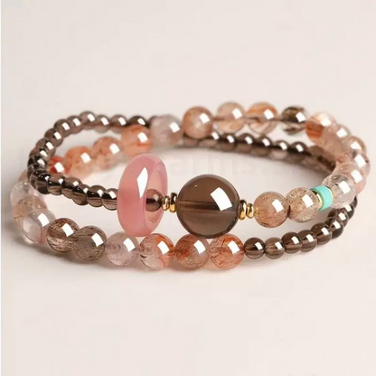 Multi-layer brown smoky quartz gemstone blessing bracelet featuring a smooth pink quartz charm and turquoise bead