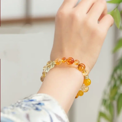 10mm earth element wealth bracelet with yellow agate, tiger's eye, amber, citrine, and alloy beads.