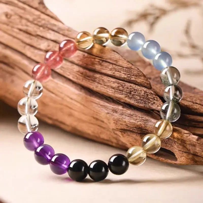 6mm Mount Putuo five elements balance crystal single-strand bracelet on wood, featuring multi-color gemstone beads.