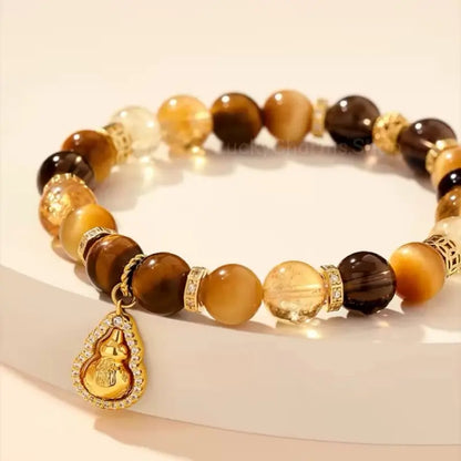 Bracelet en œil de tigre et pendentif gourde rotatif du musée du Palais