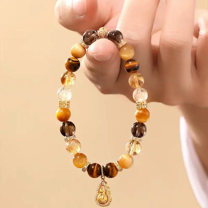 Bracelet en œil de tigre et pendentif gourde rotatif du musée du Palais