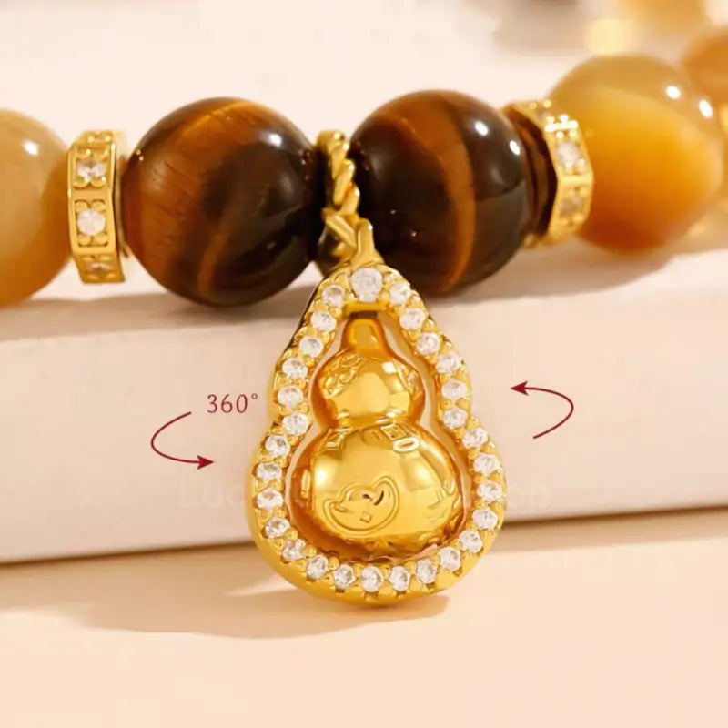 Bracelet en œil de tigre et pendentif gourde rotatif du musée du Palais