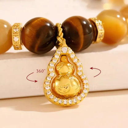 Bracelet en œil de tigre et pendentif gourde rotatif du musée du Palais