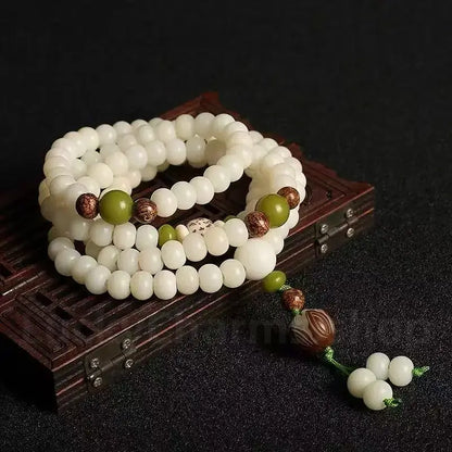 Le Mala de l'Éveil 108 – Racine de Bodhi en Jade Blanc Bio et Lotus Sculpté à la Main