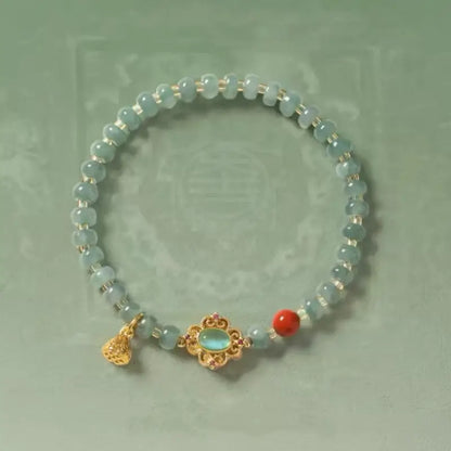 Dunhuang-Armband mit Baoxiang-Blumenmotiv, bläulich-grünem Jadeit und Lotussamenkapsel