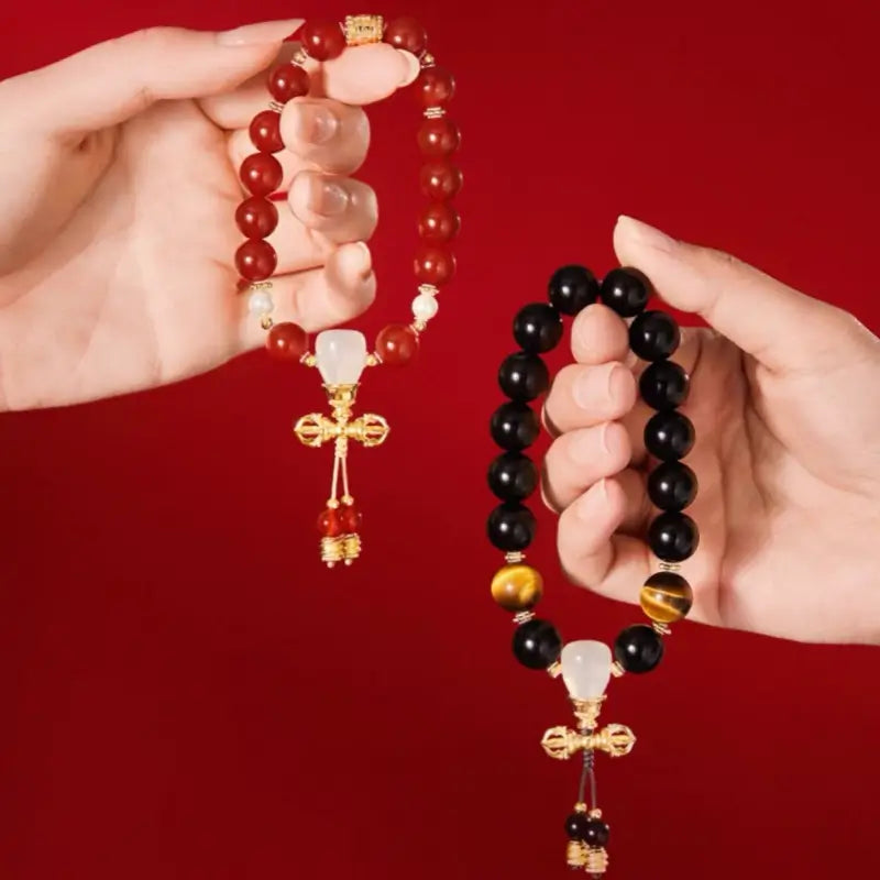 Prinz-Kung-Anwesen Set aus Rotachat- und Obsidian-Vajra-Paararmbändern