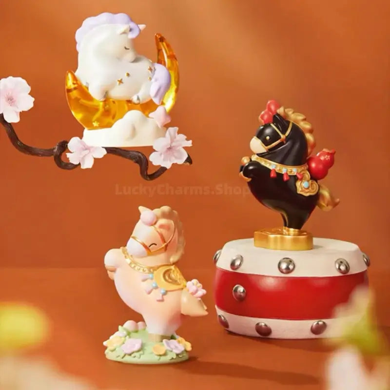 Three Palace Museum Little Fortune Horse figurines displayed together in black, beige, and white designs.