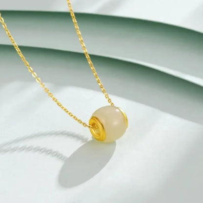 Collier pendentif Lu Lu Tong en jade Hetian incrusté d'or pur | Bijou élégant et porte-bonheur en forme de tonneau, idéal au quotidien ou à offrir
